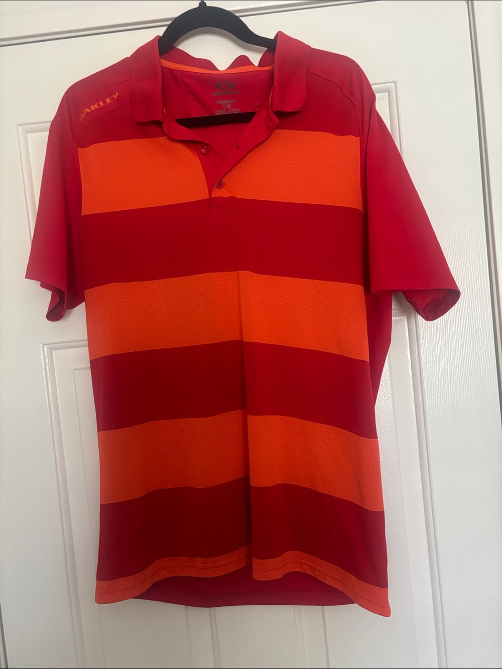 Oakley Men’s Red and Orange Striped Polo Shirt